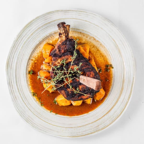 My 2 Cents LA's soul food dish: a charred pork chop with a bone, sweet potatoes, and thyme.